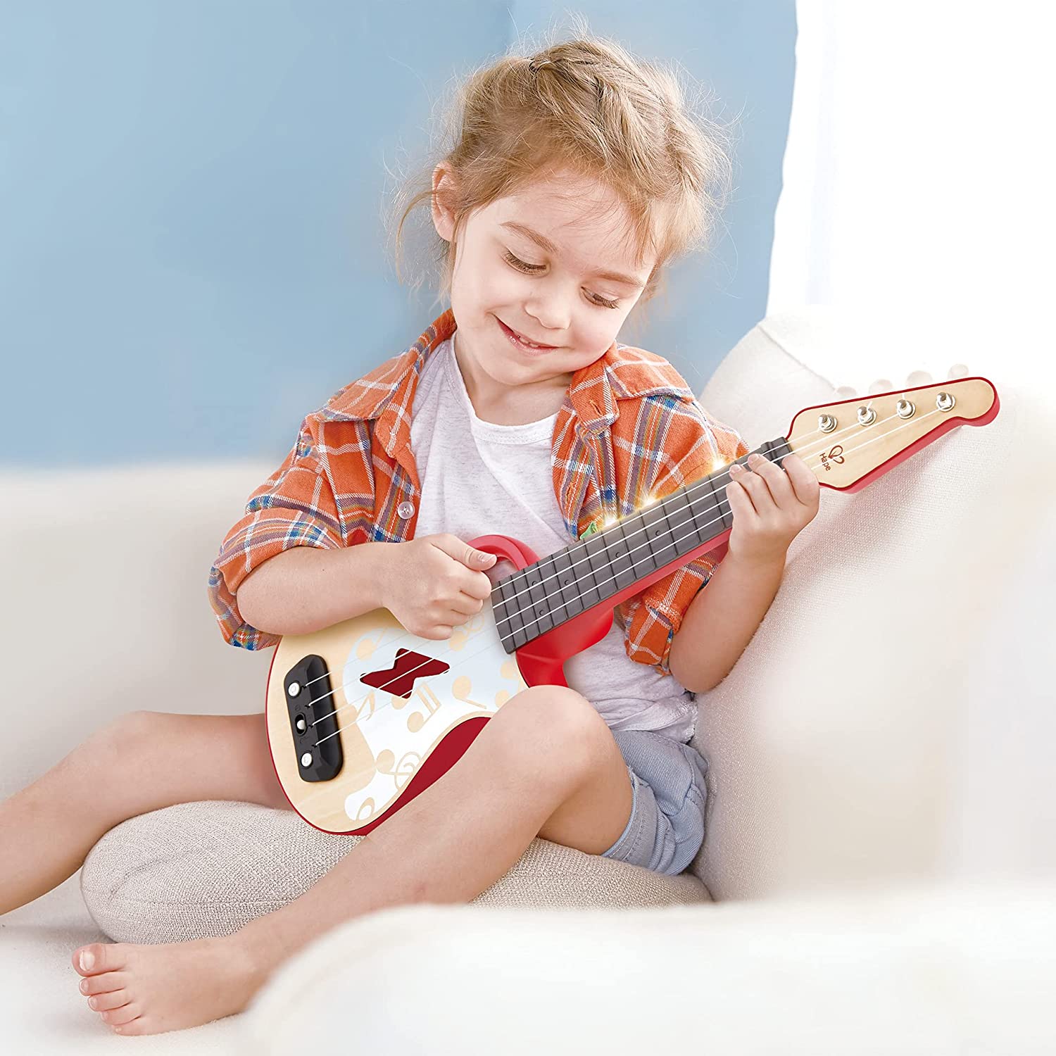 Ukulele rosso a ritmo di luci