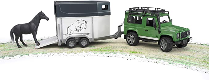 land rover defender con rimorchio e cavallo