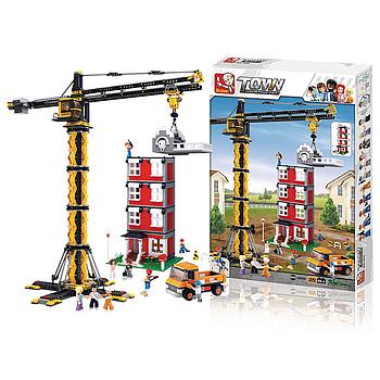 Gru da cantiere con edificio Sluban